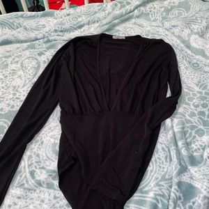 Black body suit, low cut